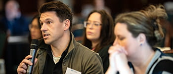 A Council member speaks at a Law Society strategic planning event.