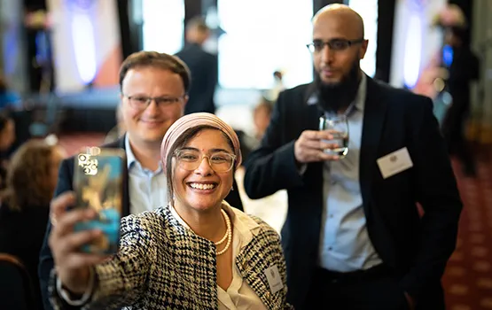 Law Society Legal Heroes smiling and taking a selfie with a mobile phone.