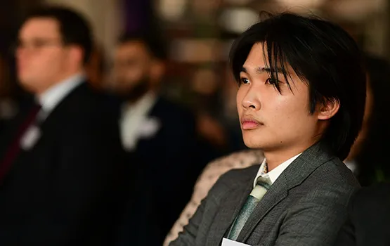 A young solicitor attends a Law Society conference.