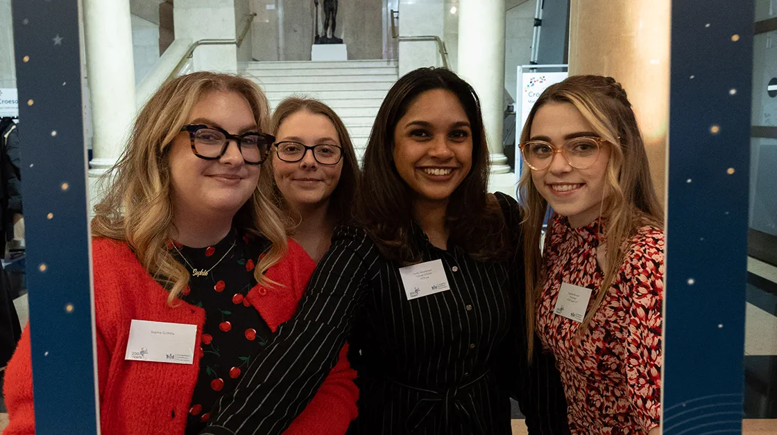 A group of solicitors pose for a photograph with the Law Society 200 years logo at the Cardiff bicentenary event.
