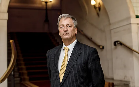 Law Society president Richard Atkinson stands on the Common Room stairs at the Law Society in London.