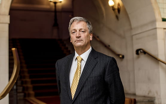 Law Society president Richard Atkinson stands on the Common Room stairs at the Law Society in London.