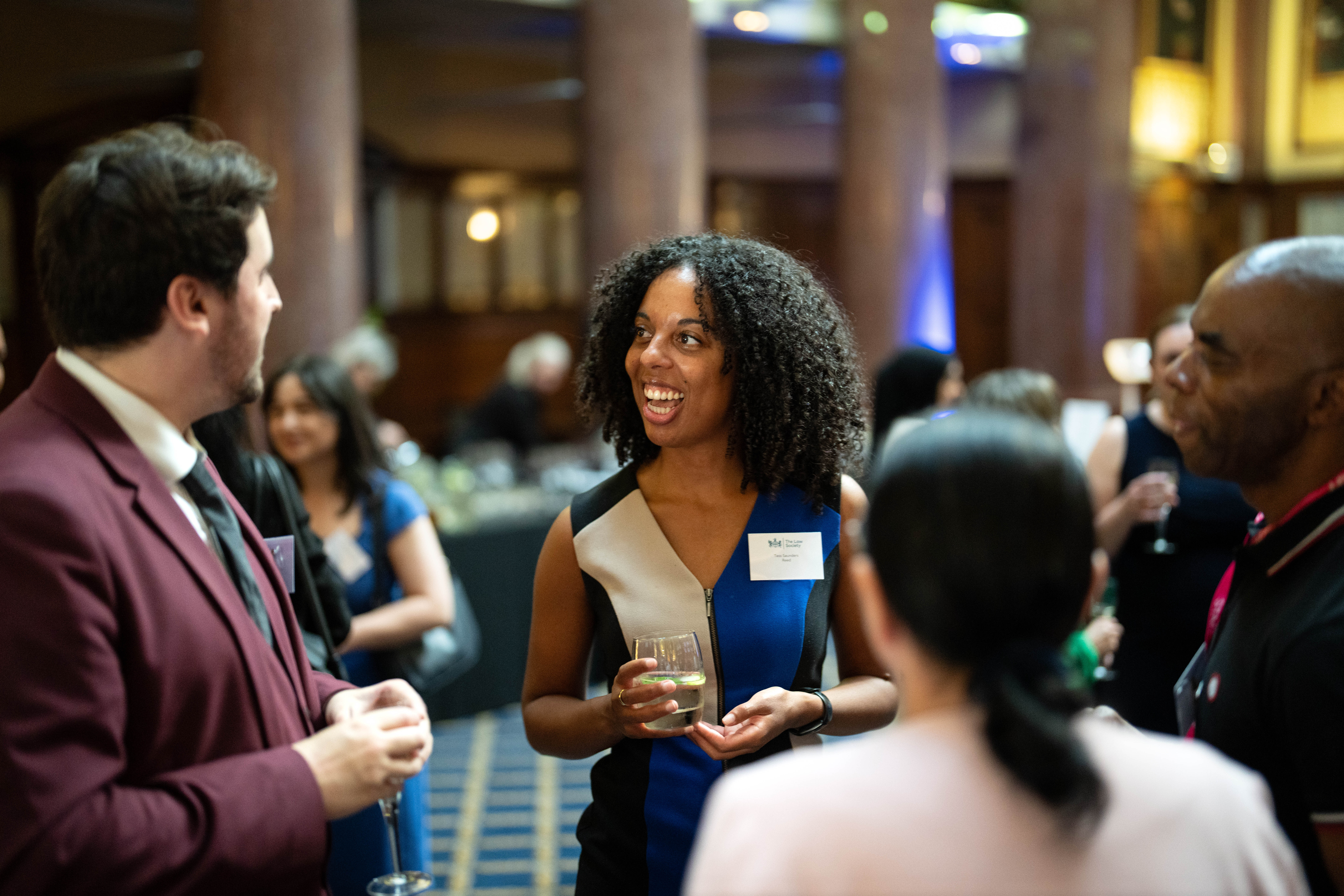 Group of people chatting at the LS DAS 20th anniversary event
