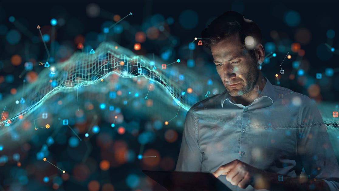 a man looks at an ipad in his hands. the background is a futuristic image.