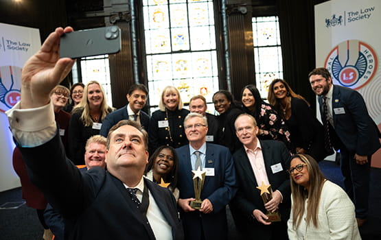 Legal Heroes 2024 winners and shortlisted individuals take a selfie with Law Society president Nick Emmerson.
