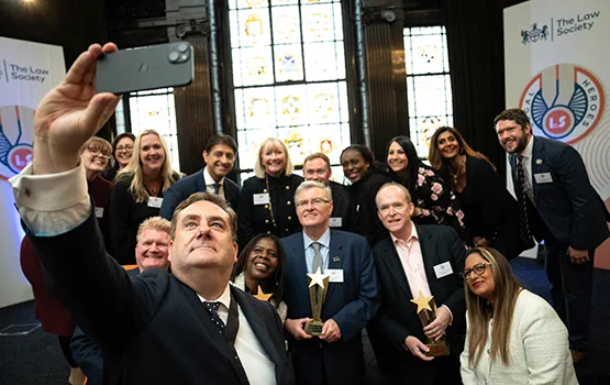 Legal Heroes 2024 winners and shortlisted individuals take a selfie with Law Society president Nick Emmerson.