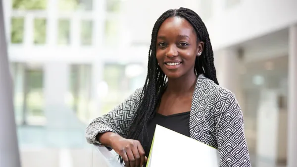 Woman holding piece of paper