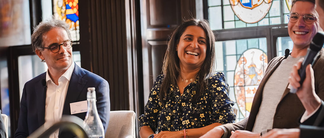Four solicitors talking at a panel event