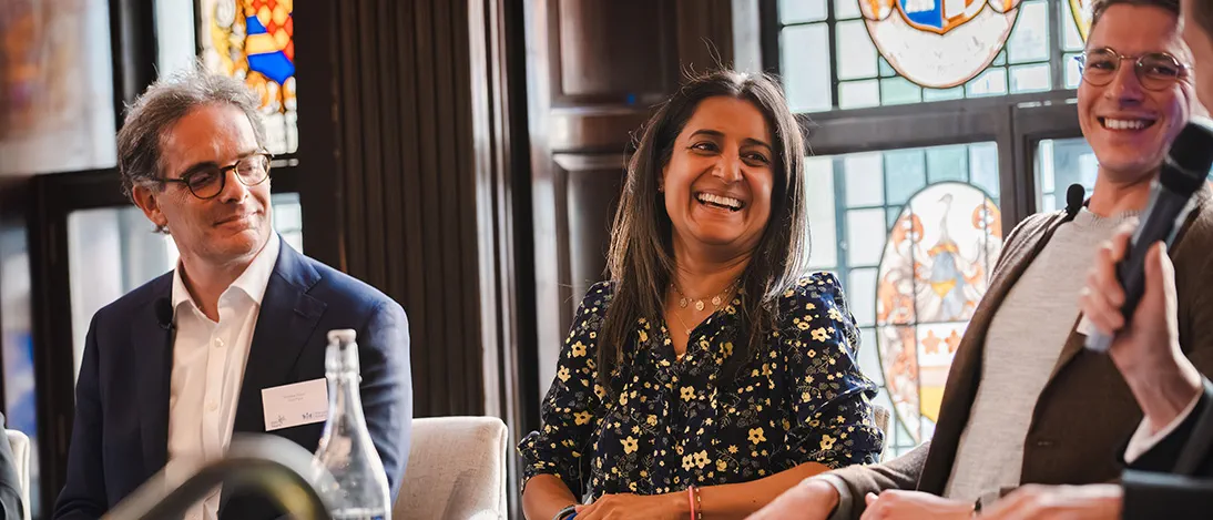 Four solicitors talking at a panel event