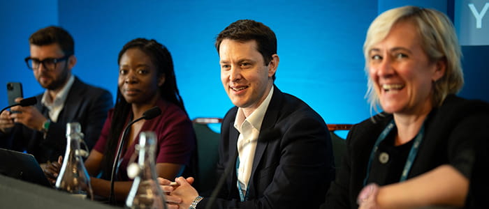 A panel of smiling speakers at the Law Society Private Client Conference.