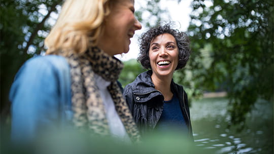 Two women laughing together