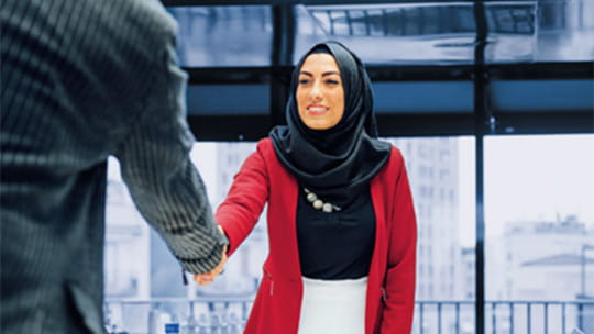 A woman shaking hands with someone