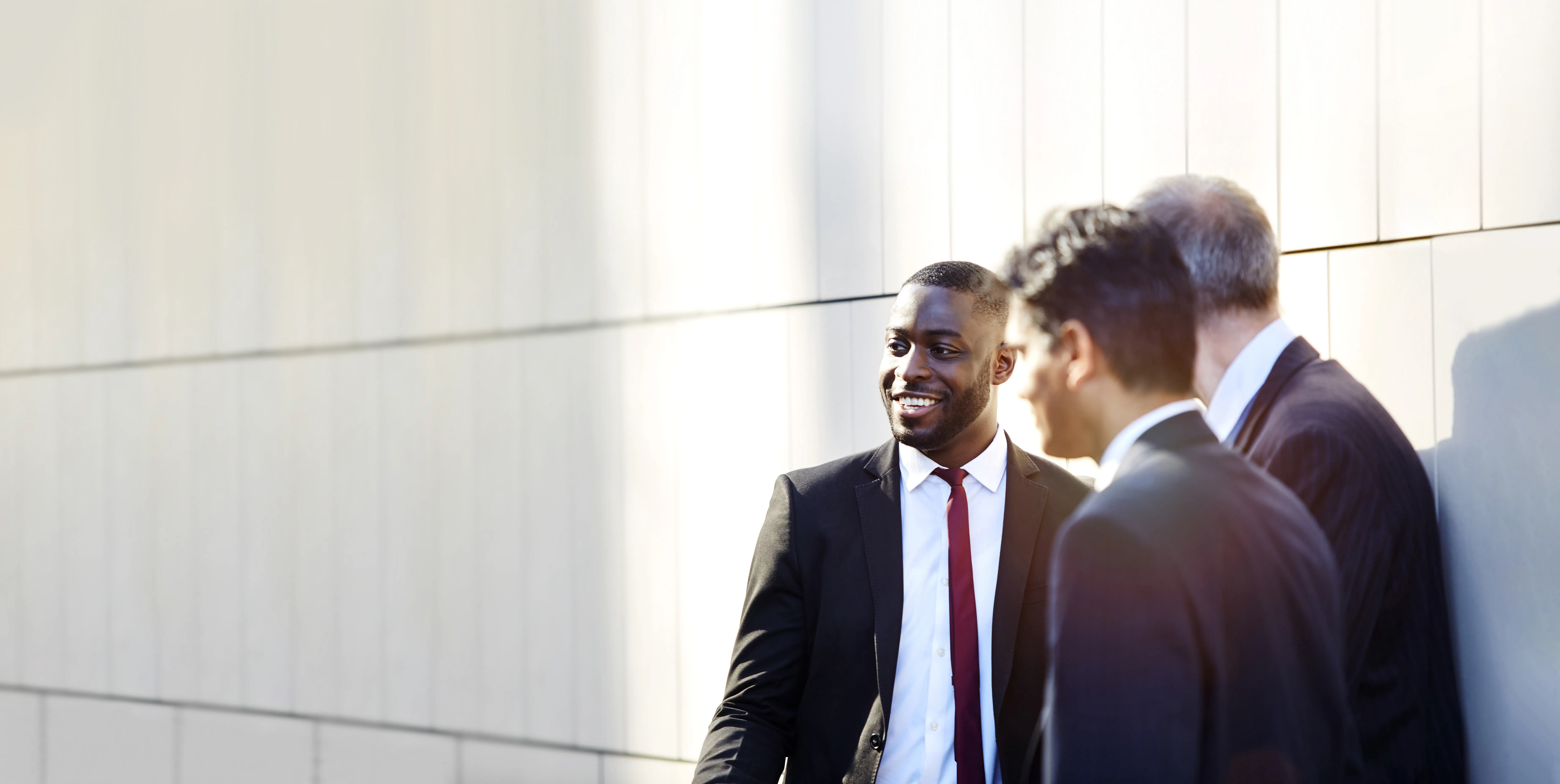 Image with three smiling men
