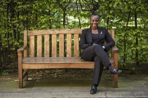 I. Stephanie Boyce sitting on a bench.
