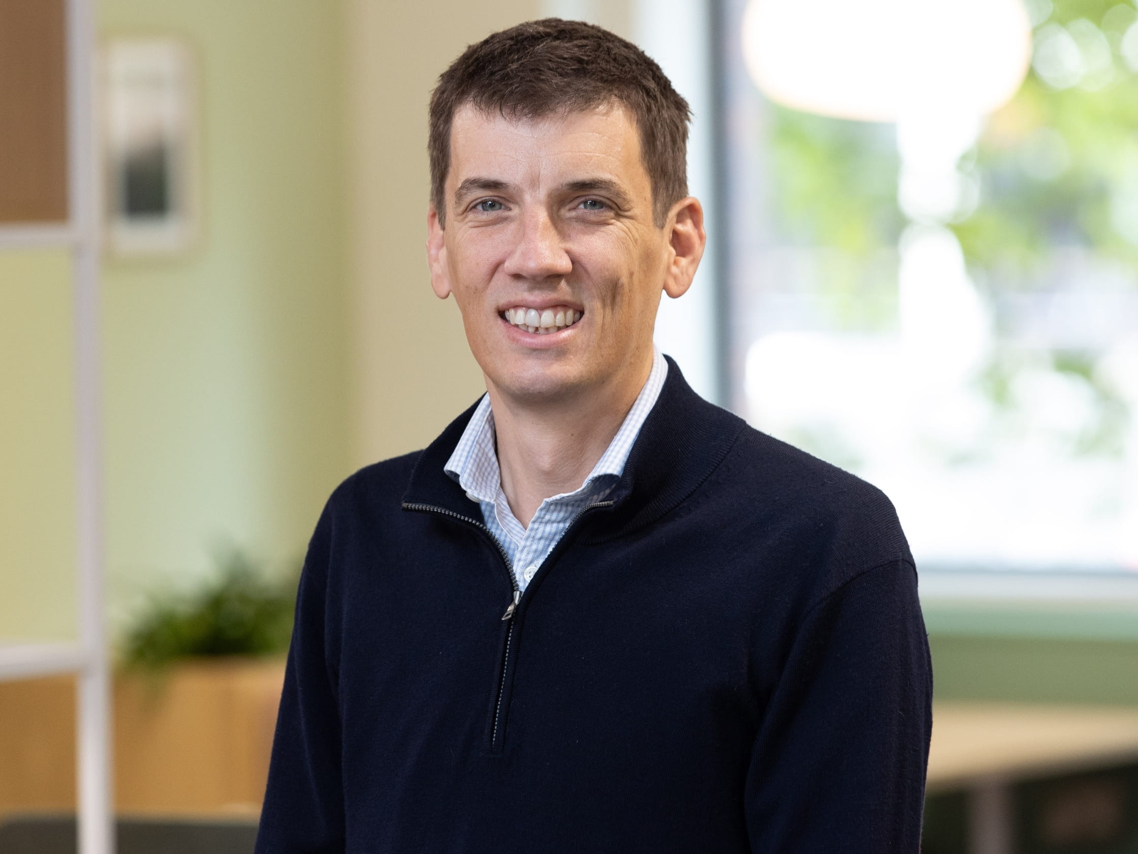 A person smiling at a camera.