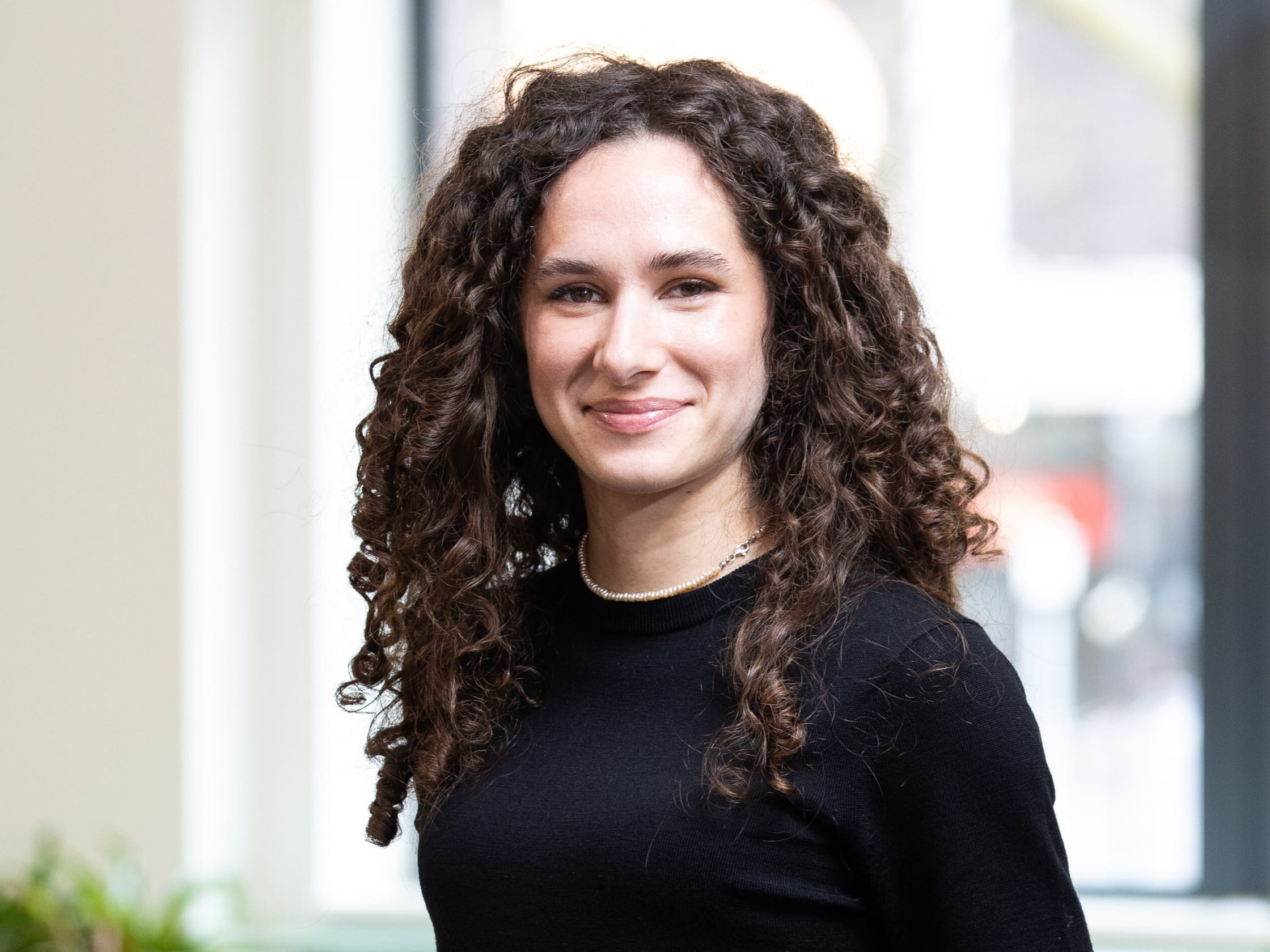 A person smiling at a camera.