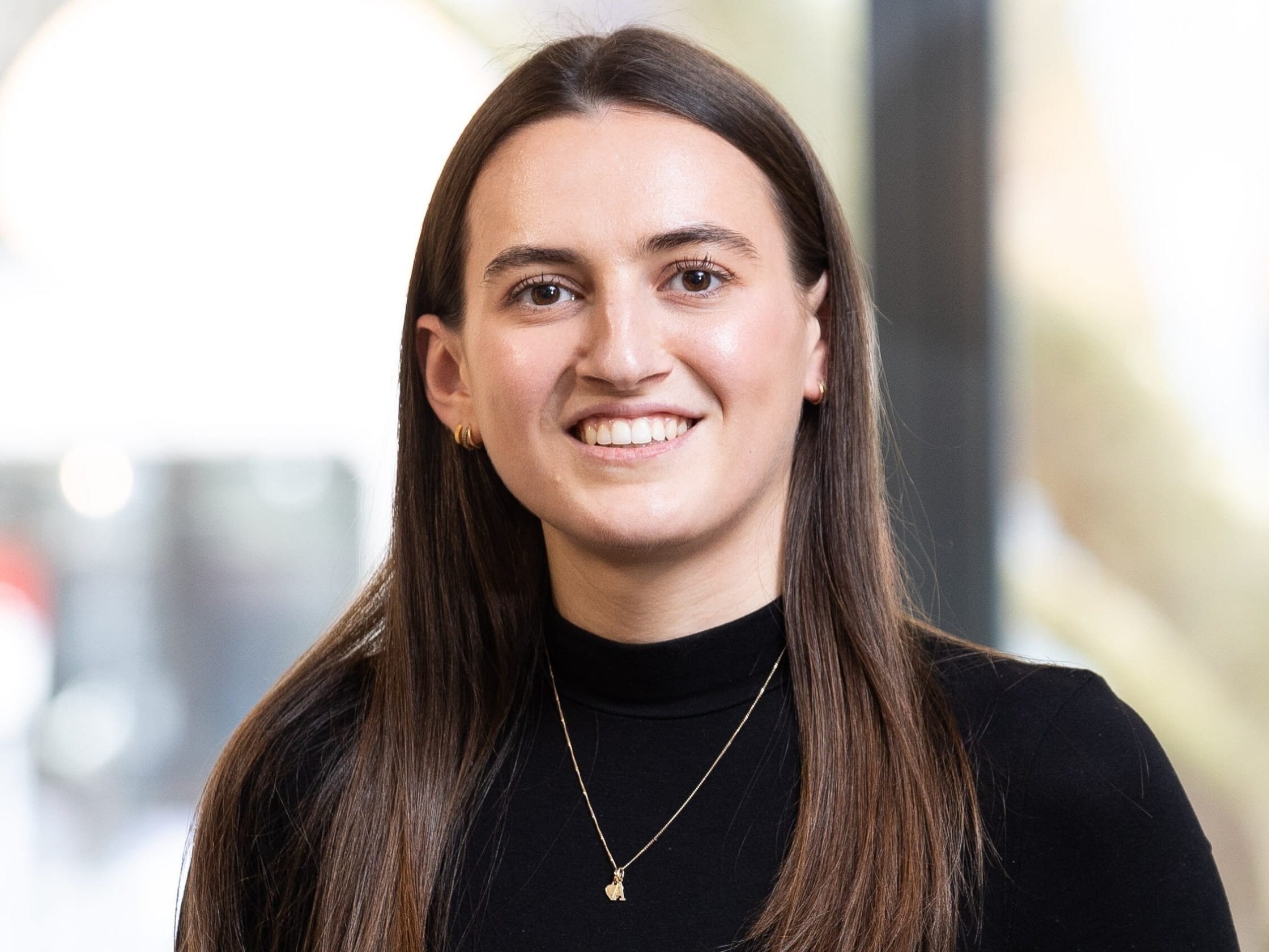 A person smiling at a camera.