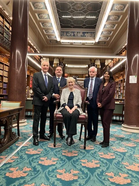 Five past presidents of the Law Society in the library.