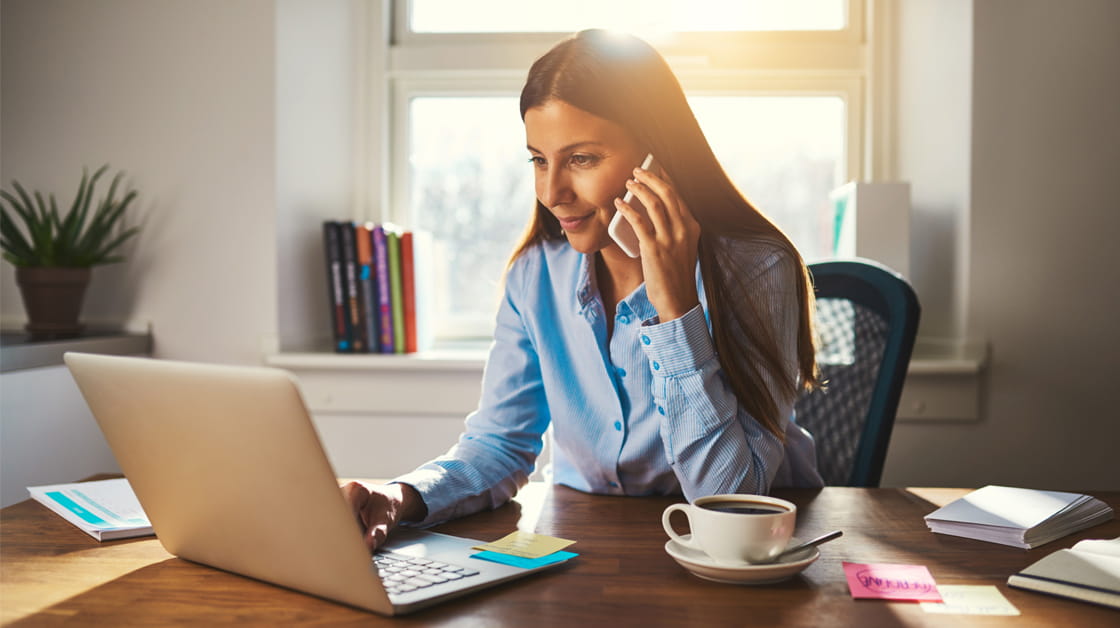 Woman working at desk at home