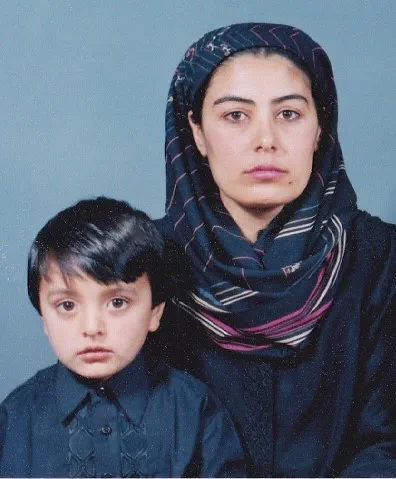 Qays as a young boy with his mother.