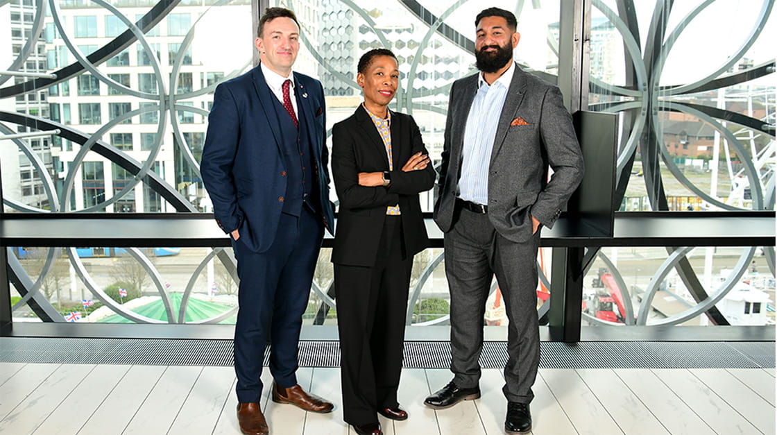 Baljinder Singh Atwal stands with solicitors Richard Port MBE and Bridget Tatham at the Law Society's bicentenary event in Birmingham 