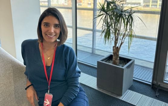 A woman sits by the window in Ofcom’s offices with a view of the Thame