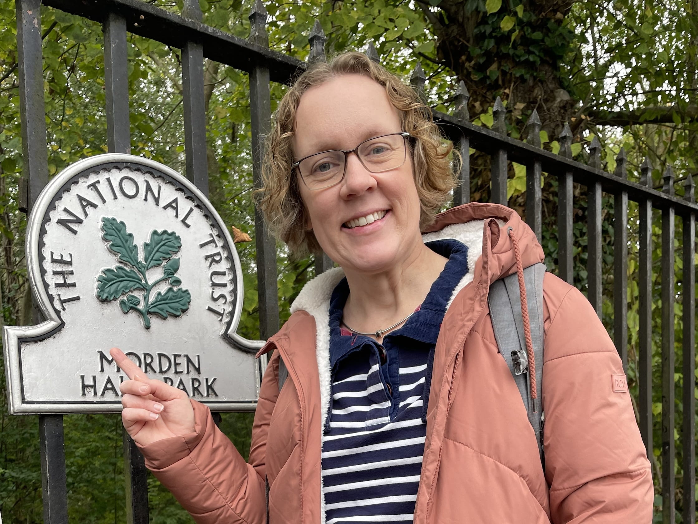 Hilary Watts smiling near a park.