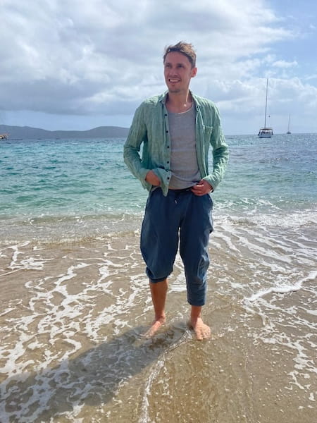 Jason Stephens, standing by the sea. 