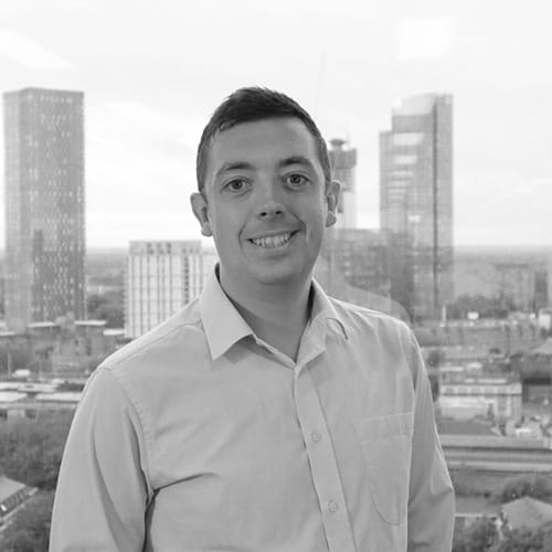 A black and white headshot of Tom Bagley. 