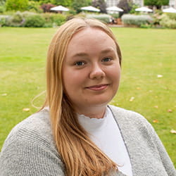 Jenny Smith is a white woman with blonde hair.