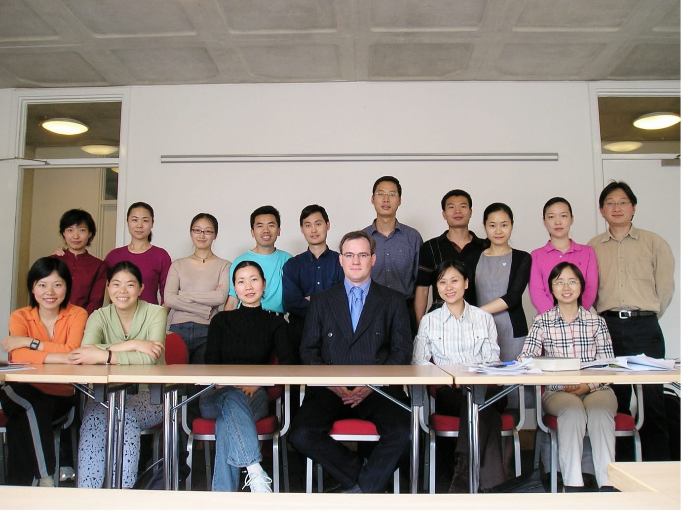 Yuhua Yang in a classroom with a group of fellow LCTS participants