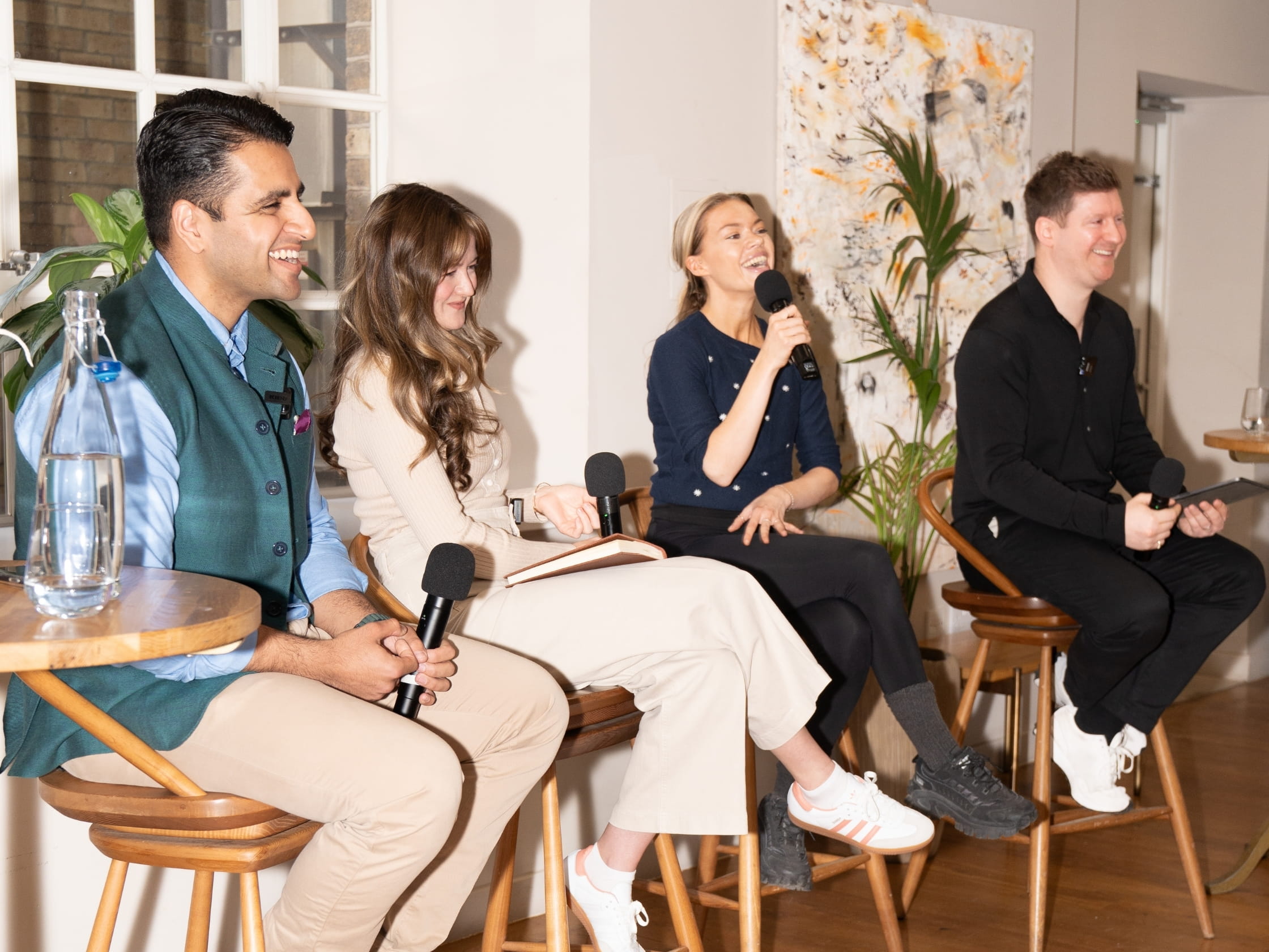 A group of people taking part in a panel discussion.