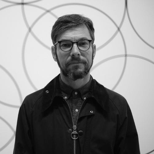 A professional man wearing glasses