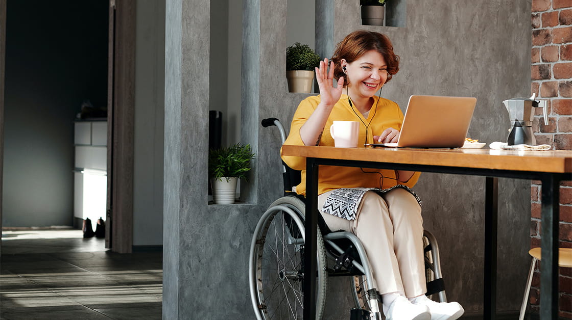Woman using a wheelchair taking a video call