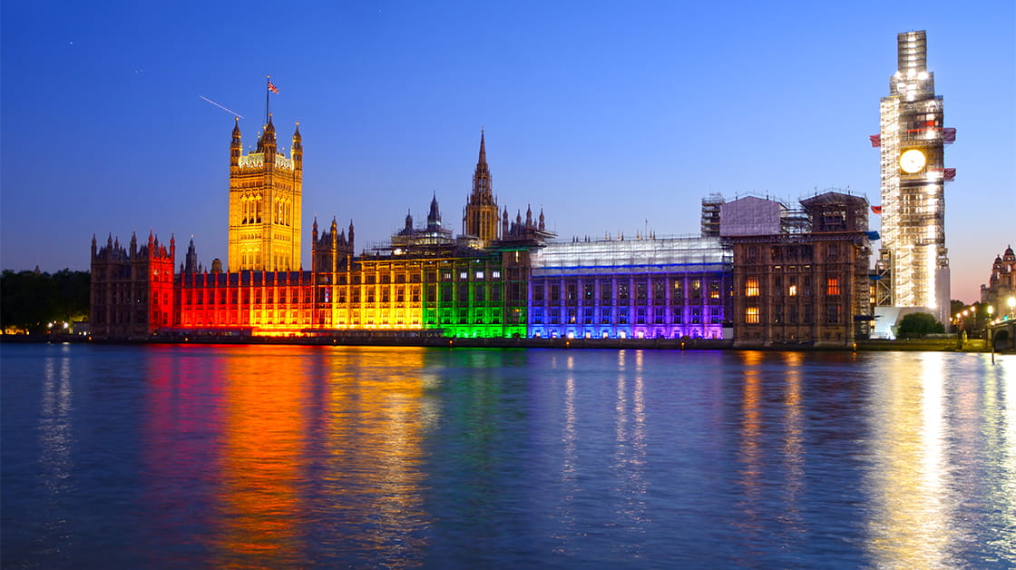 LGBT+ Pride flag illuminating the Palace of Westminster