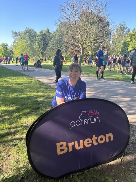 Solicitor Sarah Dwight dressed in running clothes running event in a park