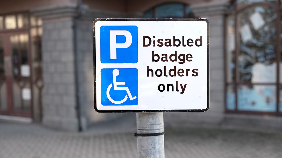 A sign stating that a parking bay is for disabled badge holders only.