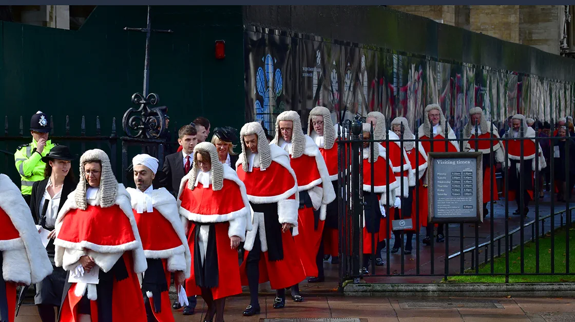 British High Court judges walk through Westminster in London to an annual ceremony at the start of the legal year