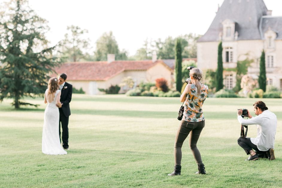 Charlotte Murray takes photos of a bride and groom on their wedding day in a beautiful outdoor setting.