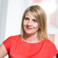 Liz Turner is a woman with shoulder length blonde hair, she is wearing business dress.