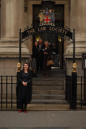 Rosie Burbidge standing outside the Law Society hall archway. 